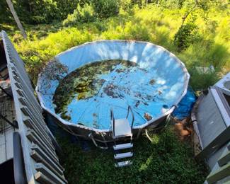 This swimming pool was set up and never filled or used. Some rain and leaves can easily be cleaned out. It comes with a new pump and ladder. Must be disassembled to move.