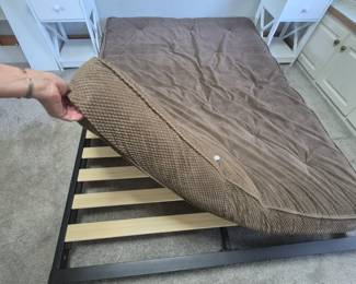 Futon mattress on wood and metal frame