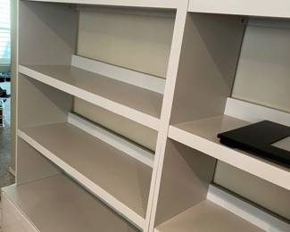 two matching West Elm bookshelves