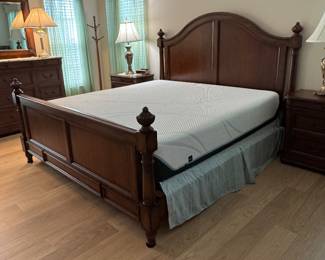 TOMMY BAHAMA–STYLE TROPICAL RESORT KING BEDROOM COLLECTION: Rich Warm-Wood Finish • Dovetail Drawer Construction • Carved Tropical Leaf Accents • Statement Panel Bed • Beveled Mirror • Coordinating Case Pieces: King Panel Bed Arched Headboard • Panel Footboard • Turned Posts & Finials • Wood Side Rails Dresser & Beveled Mirror Dovetail Drawers • Carved Tropical Leaf Accents • 12 Drawers Tall 5-Drawer Chest Dovetail Drawer Construction • Rich Warm-Wood Finish • 6 Drawers Two 2-Drawer Nightstands Dovetail Drawer Construction