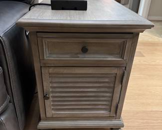 MAGNUSSEN HOME LANCASTER CHAIRSIDE END TABLES: Lancaster Collection • Grey Finish • Weathered Bronze Hardware • Side-Mount Ball-Bearing Drawer Guides • Storage Drawer • Louvered Wood Cabinet Door • 18”W × 24”D × 24”H