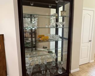 LARGE LIGHTED SLIDING-GLASS CURIO DISPLAY CABINETS — 2 MATCHING Oversized Statement Display Cabinet • Approx. 83 x 46 x 14.5 • Rich Dark Wood Finish • Sliding Glass Front Doors • Glass Side Panels • Full Mirrored Back • Multiple Glass Display Shelves • Interior Display Lighting • Elevated Furniture-Style Base