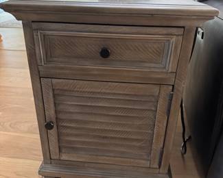 MAGNUSSEN HOME LANCASTER CHAIRSIDE END TABLES: Lancaster Collection • Grey Finish • Weathered Bronze Hardware • Side-Mount Ball-Bearing Drawer Guides • Storage Drawer • Louvered Wood Cabinet Door • 18”W × 24”D × 24”H