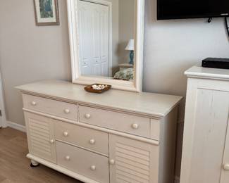 COASTAL COTTAGE QUEEN BEDROOM COLLECTION: Distressed Cream Finish • Louvered/Shutter Detailing • Wood Drawer Boxes • Metal Drawer Glides Coastal Cottage Queen Headboard: Distressed Cream Finish • Louvered/Shutter Panels • Decorative Posts & Finials Coastal Cottage Dresser & Mirror: Louvered Cabinet Doors • Multiple Storage Drawers • Wood Drawer Boxes • Metal Drawer Glides • Coordinating Framed Mirror. Coastal Cottage Nightstands: Distressed Cream Finish • Drawer with Metal Glides • Open Display/Storage Shelf • Bun Feet