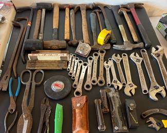 Assorted crescents wrenches and hammers.