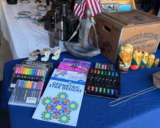 Brand new coloring books with brand new packs of markers and nesting people.