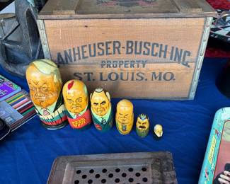 Wooden nesting dolls, antique popcorn maker and wooden box.