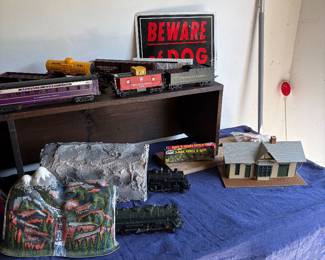Two vintage train engines and tunnels.