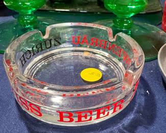 A collection of ashtrays i.e. German Beer
