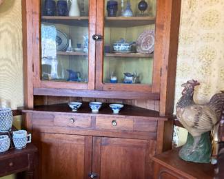 Another beautiful corner cuiro cabinet w round fret wood work over glass, 2 drawers and 2 doors .