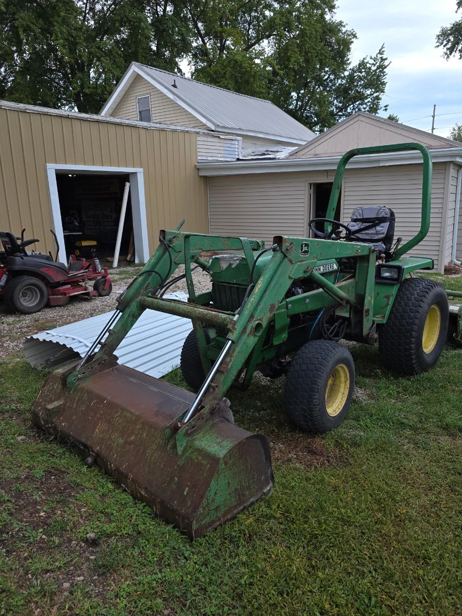 John Deere tractor with implements