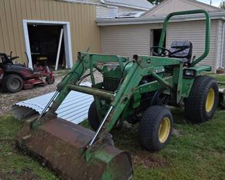 John Deere tractor with implements