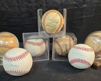 UM529Seven signed baseballs