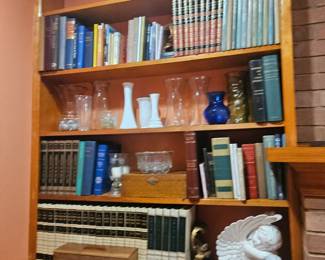 Bookcase full of trinkets and old books