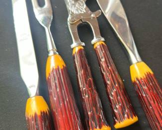 vintage carving and cutlery set featuring faux antler handles