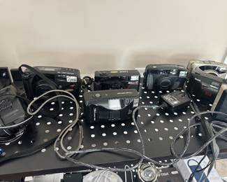 assortment of vintage 35mm point-and-shoot film cameras