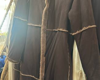 long, dark coat featuring textured fur 