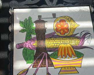 vintage cast iron and porcelain/ceramic tile trivet