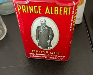 vintage red-and-yellow Prince Albert Crimp Cut tobacco tin 