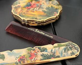vintage folding pocket comb and a matching powder compact