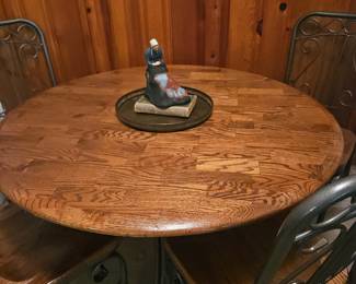 Round butcher block style dining table with chairs