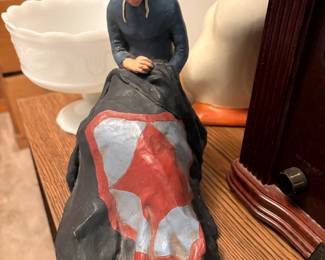 Amish style lady quilting sculpture