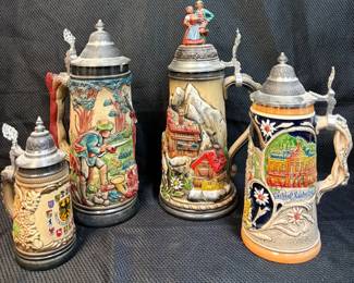 Four Traditional, Handpainted Ceramic and Stoneware German Beer Steins Featuring Pewter Lids