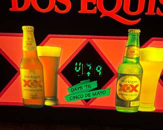 Vintage illuminated Dos Equis sign