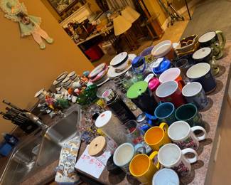 lots of kitchenware, novelty & travel themed shot glasses, and small appliances