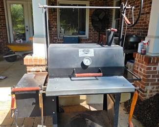 Engelbrecht Grills Original Braten 1000 wood-fired grill, featuring upper crank wheel for adjusting the cooking grate height. Includes original heavy duty cover