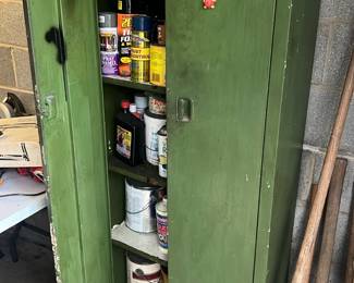 olive green vintage double-door metal storage cabinet 