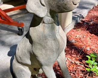 One of a pair of cement dogs