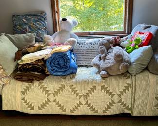 Daybed with child’s items and more