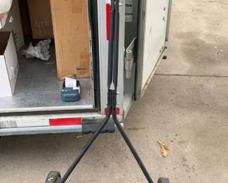 Manual Reel Lawn Mower — Classic push reel lawn mower with a five-blade cutting cylinder and pneumatic wheels; a simple, chemical-free option for small lawns. Sturdy tubular steel frame and foam-grip handles show typical surface wear and light surface rust on the roller and blade areas but appears structurally sound. Blades will likely benefit from cleaning and sharpening before regular use; wheels roll and handle folds slightly for storage. Ideal for eco-conscious mowing of small yards or for someone wanting a low-maintenance mechanical mower.