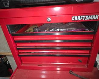 Craftsman Red 5-Drawer Tool Chest — Sturdy red Craftsman 5-drawer tool chest top with lockable lid and five sliding drawers for organized hand tools. Solid steel construction with black drawer trim shows typical shop wear and light surface scratches but no major dents; lock present though key not shown. Compact top-chest style fits on a matching rolling cabinet or workbench and is useful for everyday garage storage. Overall functional with cosmetic wear consistent with regular use; see photos for condition details and internal contents.