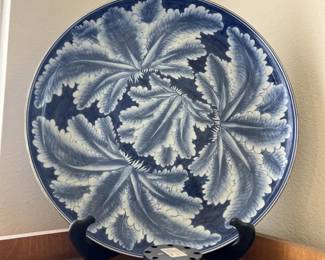 Large blue and white ceramic decorative plate with feather pattern