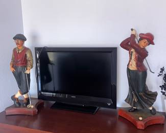 Vintage large resin statue set of male and female golfers