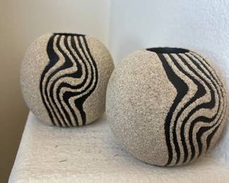 Pair of black and sand, textured spherical ceramic decorative vases
