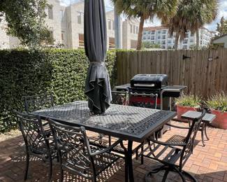 Cast Aluminum Patio Dining Set with Swivel Chairs and Striped Cushions
