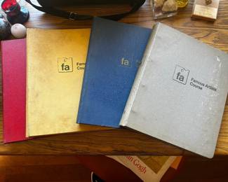 Stack of vintage Famous Artists Course hardbound instructional binders/books from the mid-20th century.