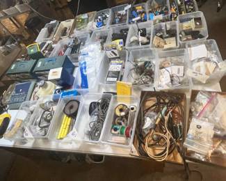 LARGE TABLE FULL OF ELECTRONIC STUFF
