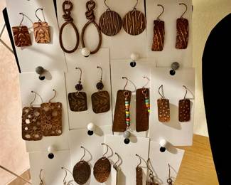 Lots of unique earrings, necklaces, and bracelets you have to see
