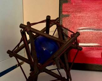 A vintage 3-D puzzle called the philosopher‘s knot or Plato‘s secret features a hand blown glass orb