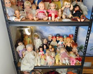 Dolls. Metal shelves not for sale