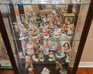 Swarovski and Hummel Collection (and more) inside of a Side-entry Curio Cabinet