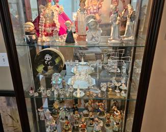 Swarovski and Hummel Collection (and more) inside of a Side-entry Curio Cabinet
