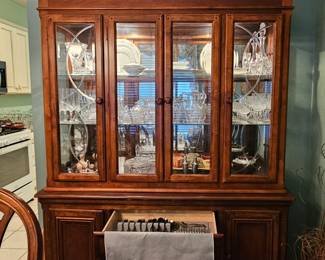 Beautiful China Cabinet by Alexander Julian full of Crystal and other collectibles