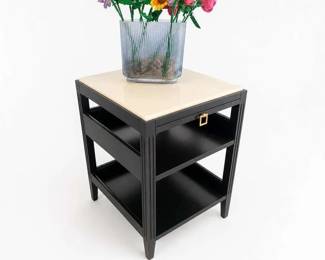 Black three-tier accent side table with cream faux-marble top and gold pull
Price: $60.00
Condition: Good
Rectangular black open-shelf end table/nightstand with a light cream faux-marble or stone-look top, three-tier storage layout, and a small brass/gold pull on the front upper shelf area. Condition appears good from the visible side, with no obvious structural damage visible in the image.