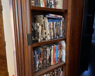 Pull out storage compartments on media center houses your DVD collection