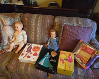 Barbie cases with dolls and clothes